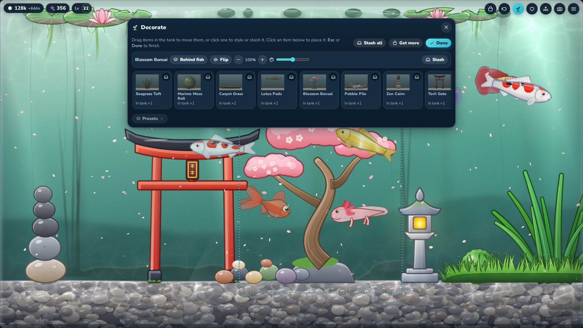 The Decorate tray open with a blossom bonsai selected, showing buttons for layer, flip, size and tint, above a pond tank with a torii gate and a lantern.